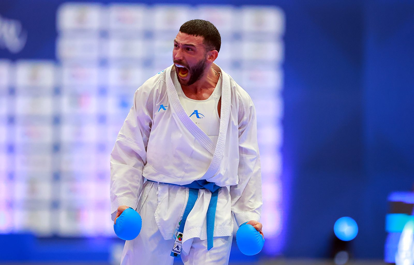 A kumite competitor roars in celebration at the Karate1 Series A in Guadalajara