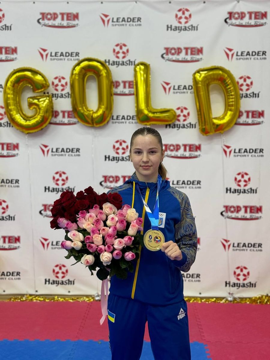 Mariia Hnes celebrates with her gold medal