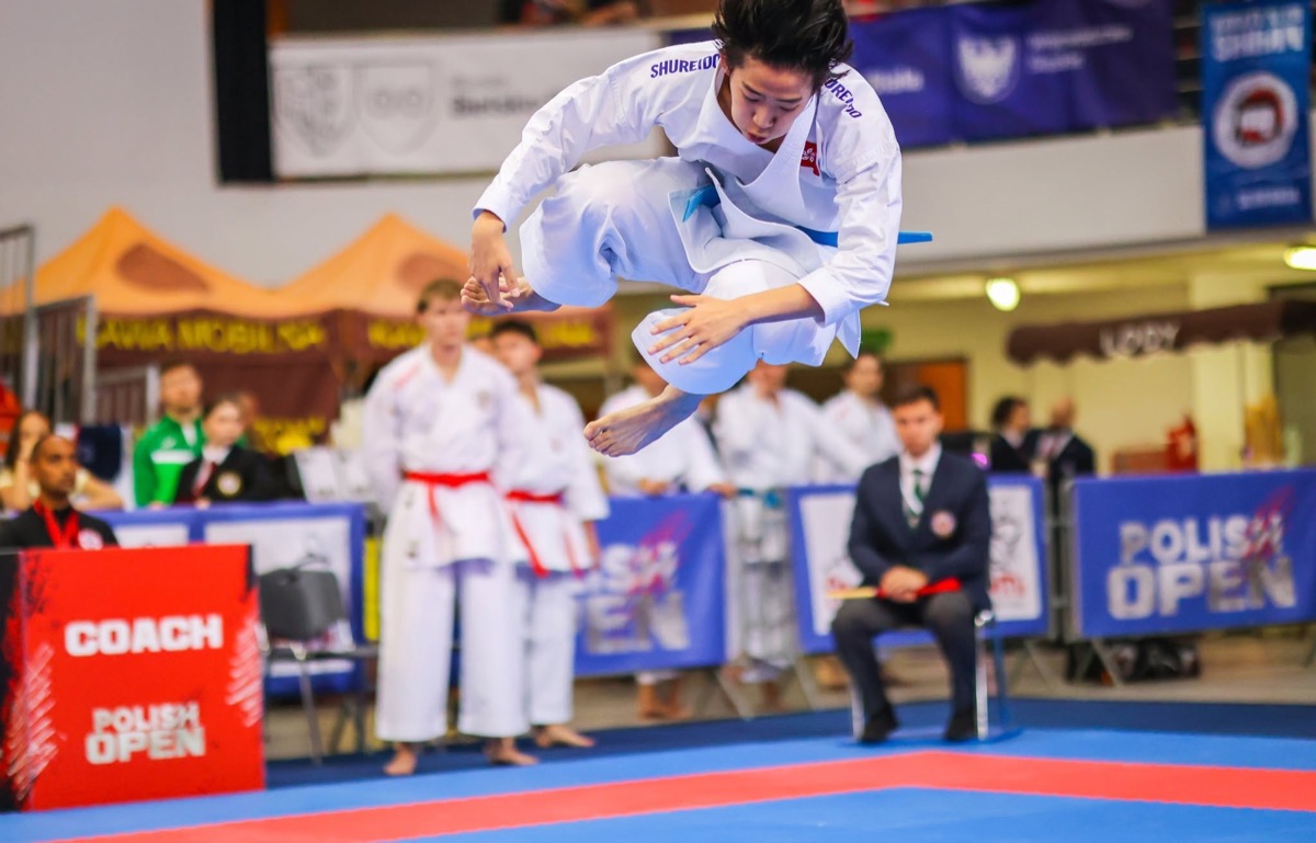 A competitor mid-air during kata at the Polish Open 2026
